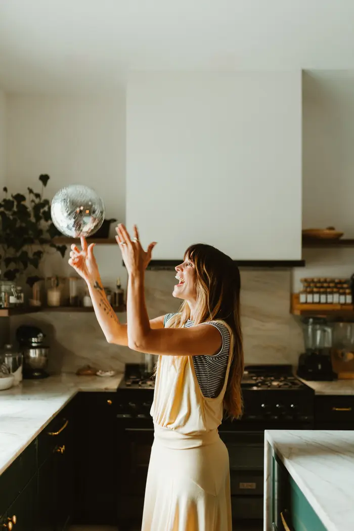 Jess laughing in her kitchen